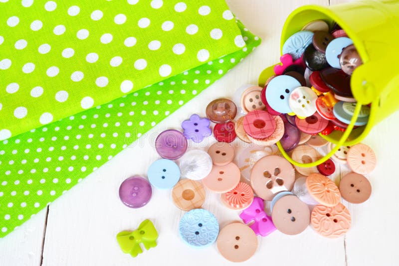 Two Pieces of Green Fabric with Polka Dot Pattern, Colorful Buttons Set