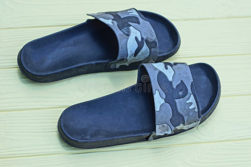 Two plastic black gray summer slippers royalty free stock images