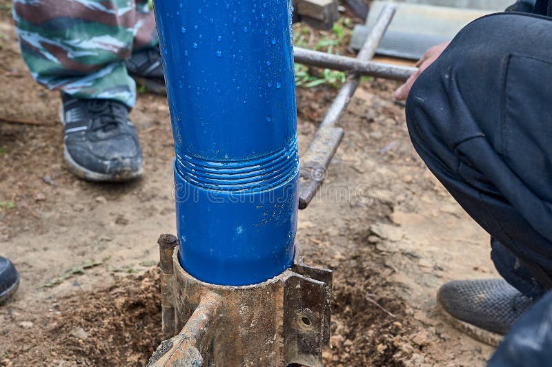Two Plastic Pipes are Connected To Each Other and Inserted into the