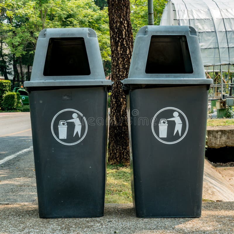 Two Black Garbage Bins and Two Blue Recycle Bins. Public Trash Waste