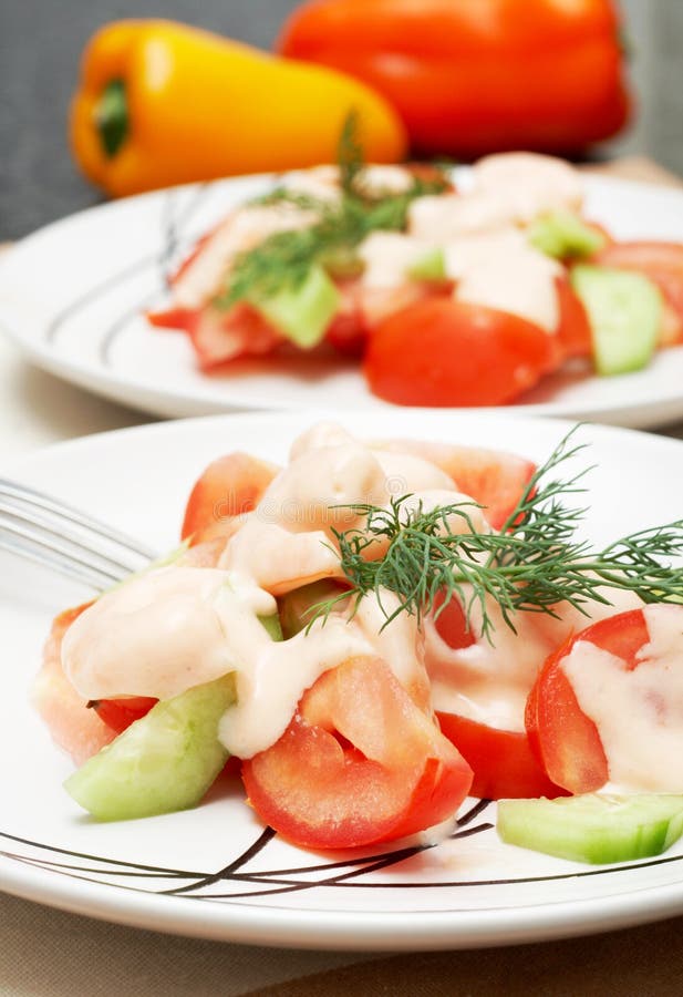 Two plates of colorful shrimp salad