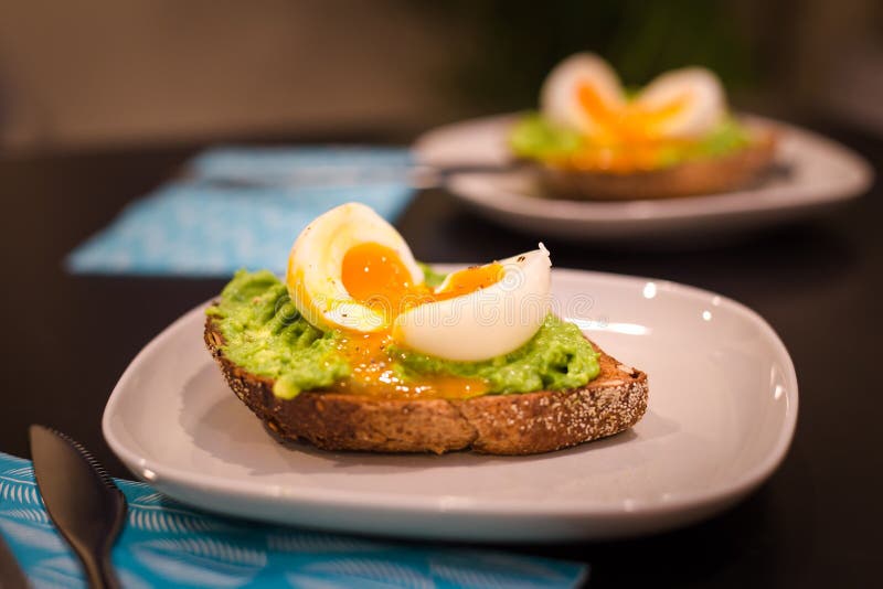 Two Plates with a Healthy Breakfast of Avocado on Toast with a Soft ...