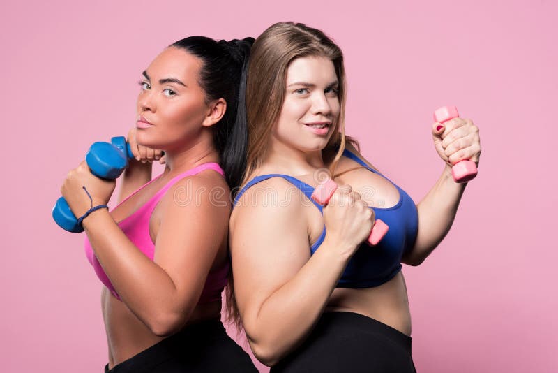 https://thumbs.dreamstime.com/b/two-plump-women-exercising-dumbbells-strong-portrait-young-beautiful-overweight-ladies-standing-back-to-each-other-82557298.jpg