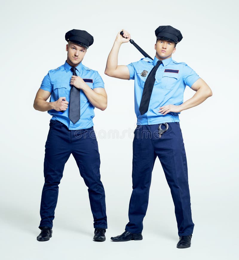 A girl in the uniform of a policeman Dances a striptease.