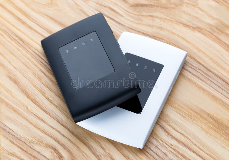 Two portable routers on the table. royalty free stock image