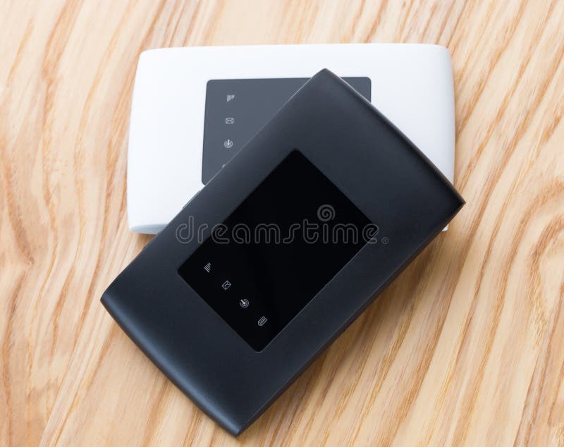 Two portable routers on the table. stock image