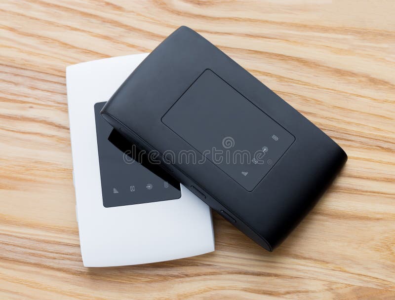 Two portable routers on the table. stock photo