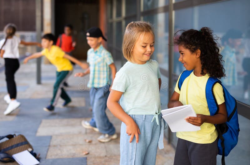 Two Preteen Schoolgirls Talking Near School Building Stock Image ...