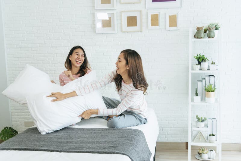 Two Pretty Best Friends Forever Girlfriend Talk Hug And Laugh Together On Bed At Cozy Home