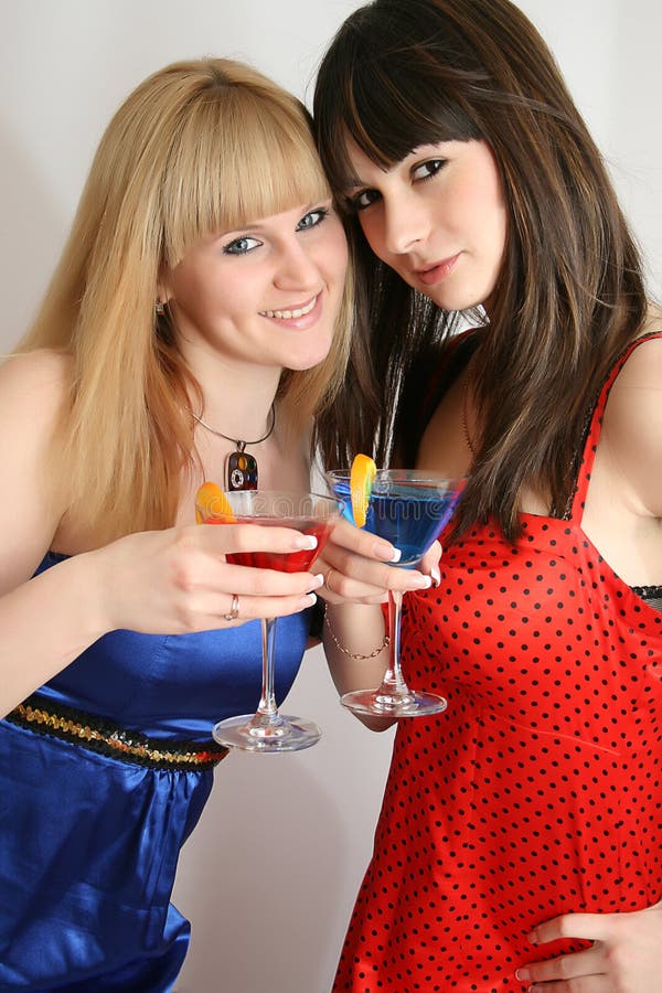 Two pretty friends with cocktail