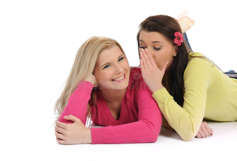 Two pretty girl friends having fun and laughing