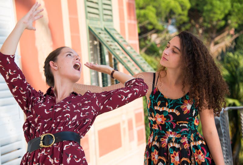 Two pretty girls are fighting and pulling their hair stock photos Two pretty girls are fighting and pulling their hair stock photos