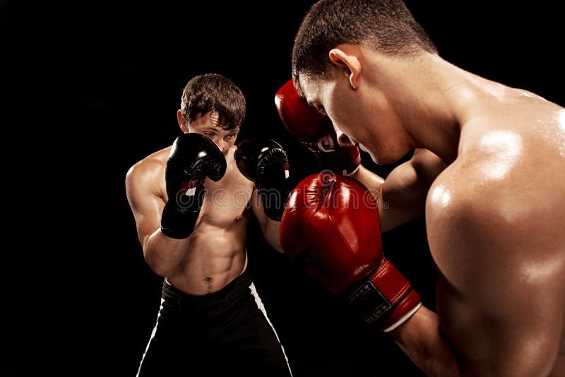 Two Professional Boxer Boxing on Black Smoky Background, Stock Photo