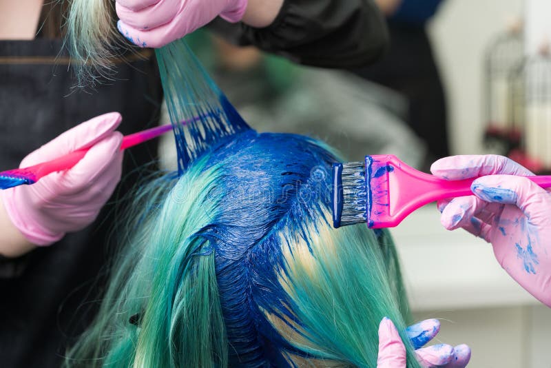 Two Professional Hairdressers Applying Blue Paint To Female with Emerald  Hair Color during Process of Dyeing Hair in Stock Image - Image of fashion,  salon: 207514801