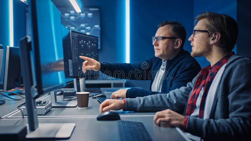 Two Professional IT Programers Discussing Blockchain Data Network Architecture Design and Developm stock photos