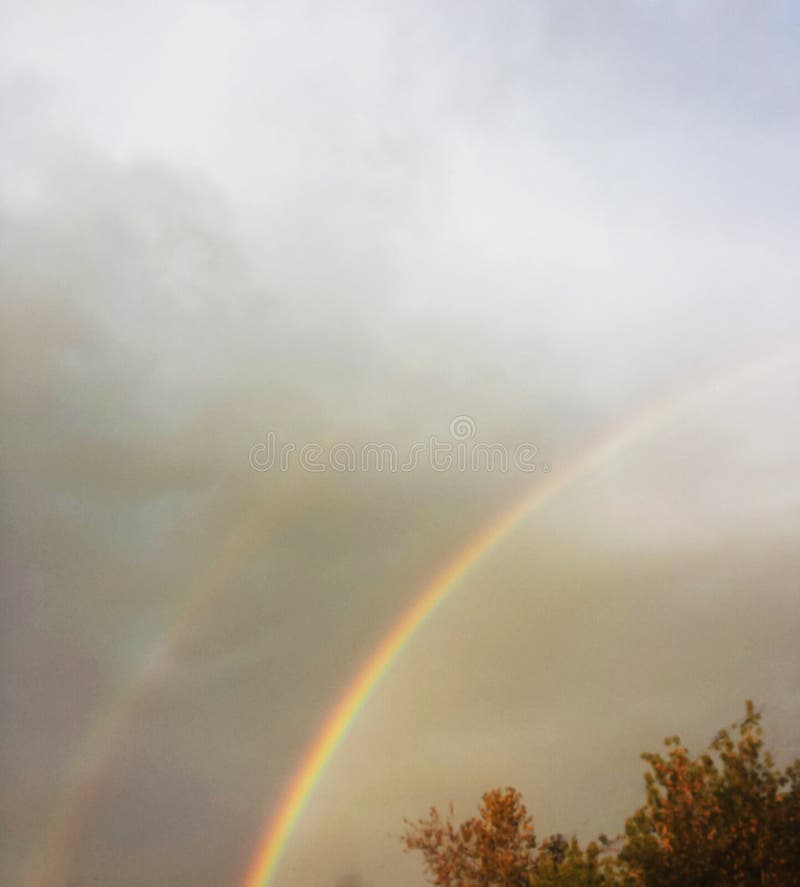 Two rainbows in the sky after the rain stock photography Two rainbows in the sky after the rain stock photography