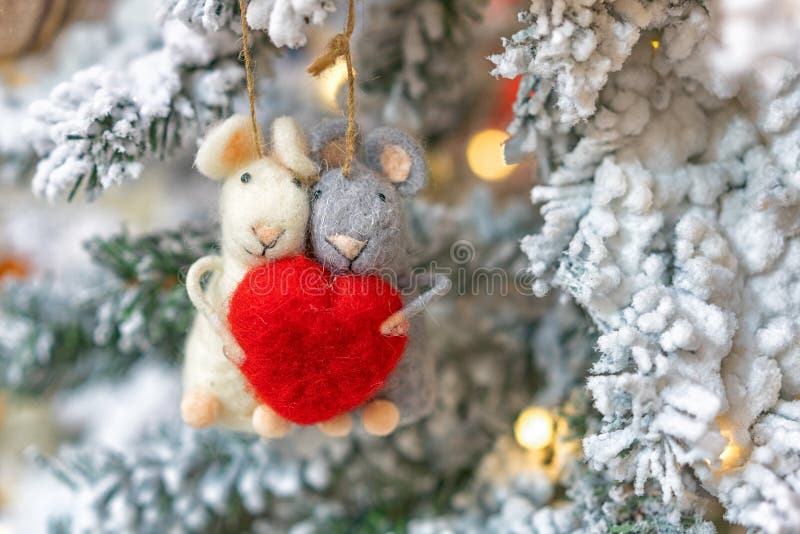 Two rats hanging on a Christmas tree, holiday decoration stock images Two rats hanging on a Christmas tree, holiday decoration stock images