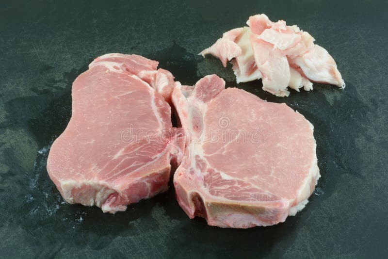 Raw center cut pork chop meat