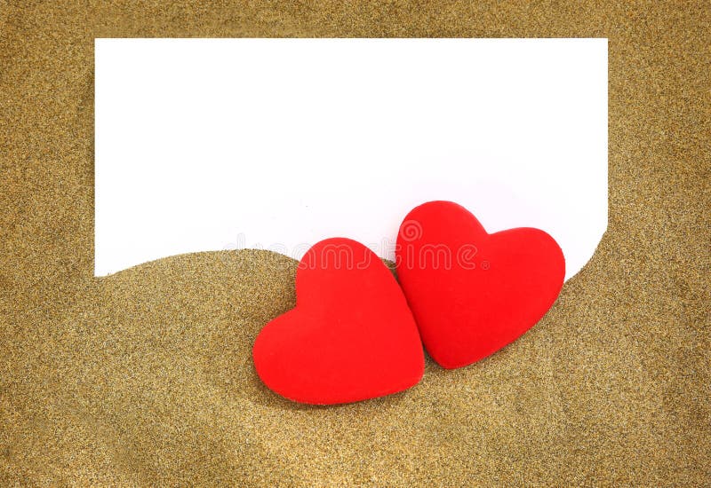 Two red hearts with blank card