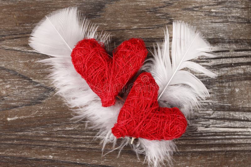 Two Red hearts on wooden background