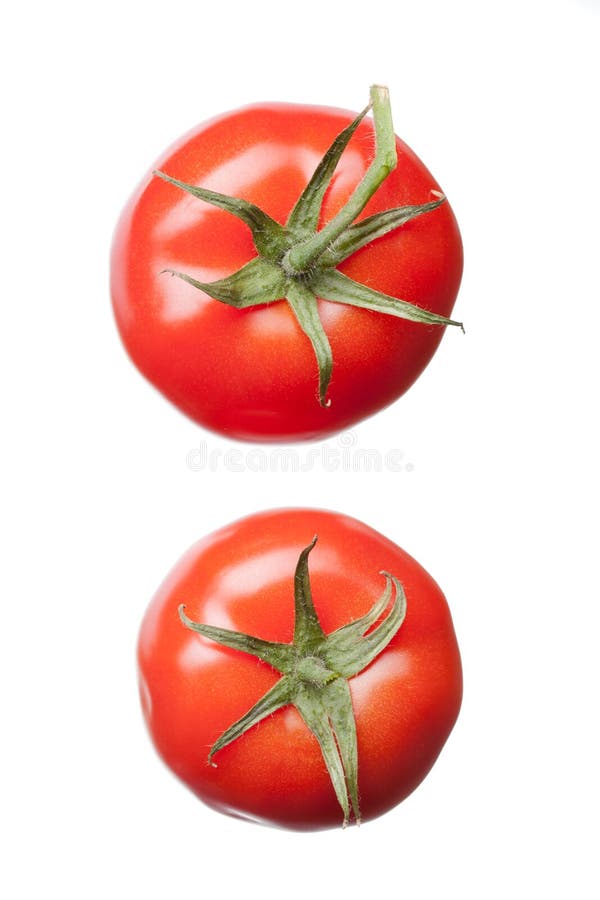 Two red tomatoes isolated on white