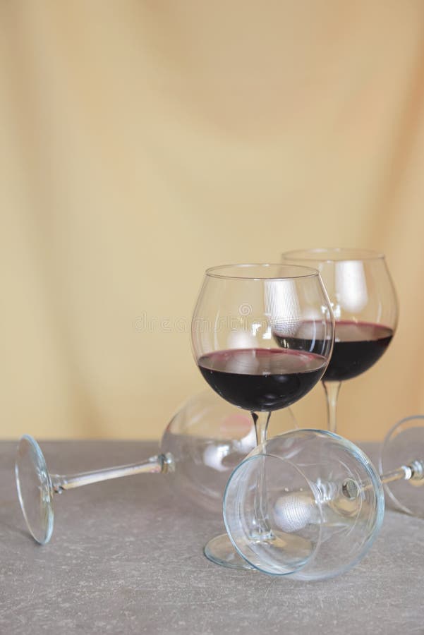Two Red Wine Glasses and Two Empty Wine Glasses on the Table. Creative