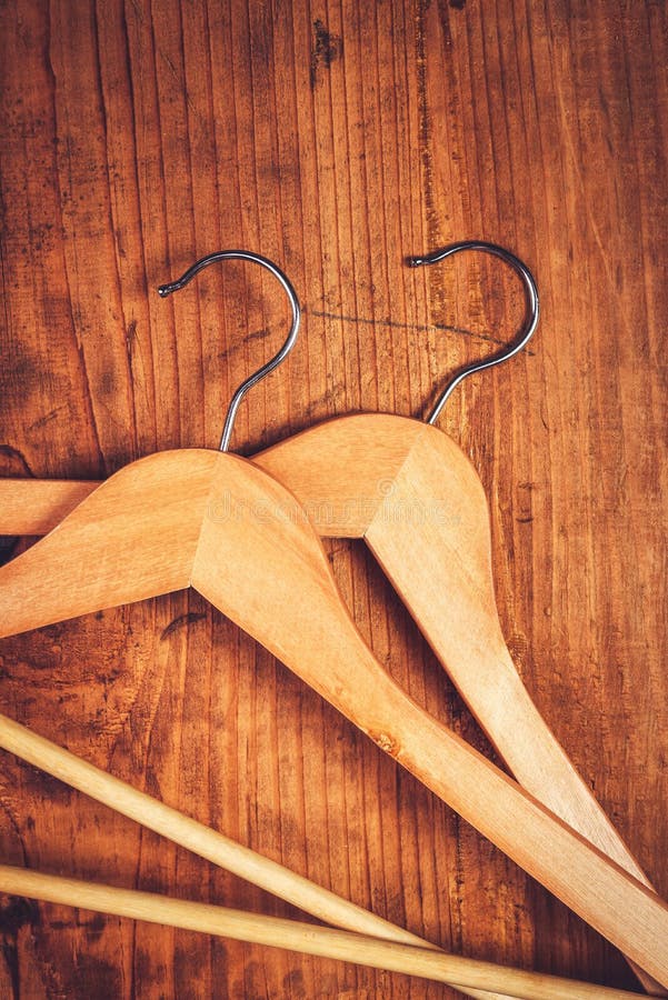 Two Retro Cloth Hangers on Rustic Wooden Background, Top View Stock