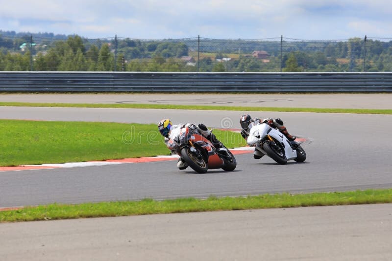 Two Riders on Motorcycles Riding on the Race Track Stock Image Image