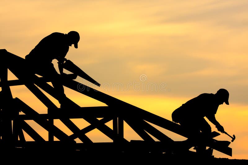 Two Roofer working on roof structure sunflare