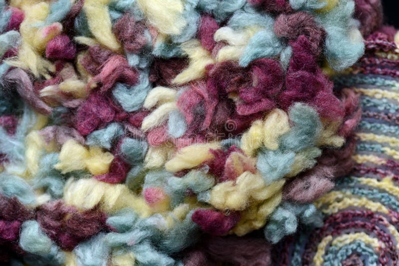 Two Round Crocheted Fragments of Fluffy Multicolored Yarn Closeup