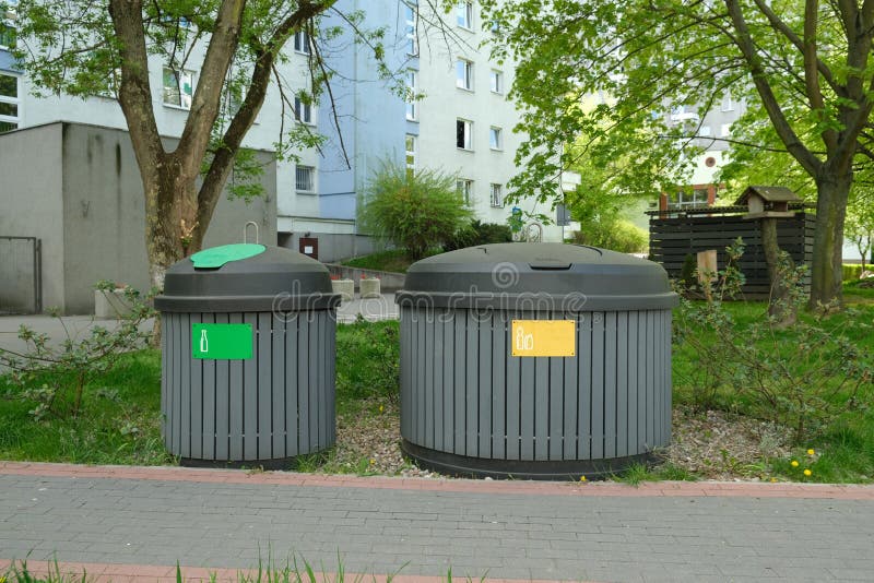 Two Round Garbage Cans for Sorting Garbage Stand on the Street Stock