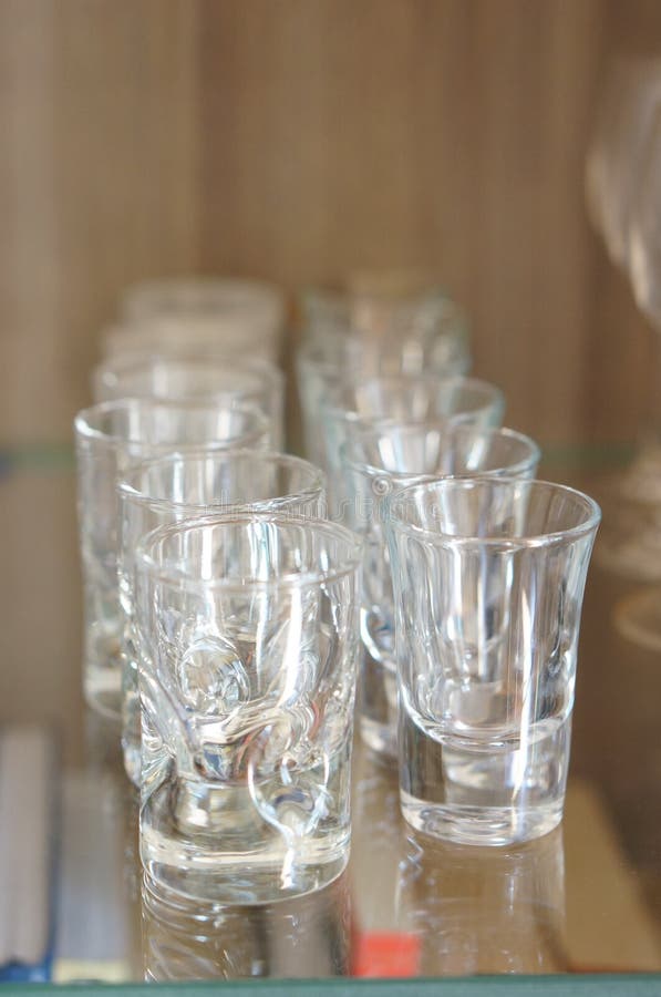 Rows of Empty Shot Glass Cups on a Glass Table Stock Photo Image of drink, glass 234588238