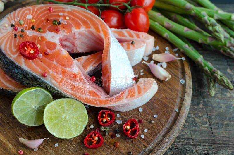 Two salmon steaks with vegetables and spices royalty free stock photos Two salmon steaks with vegetables and spices royalty free stock photos