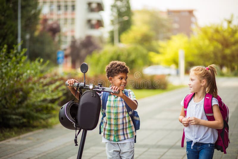 https://thumbs.dreamstime.com/b/two-school-kids-together-outside-kid-electric-scooter-go-home-218260405.jpg