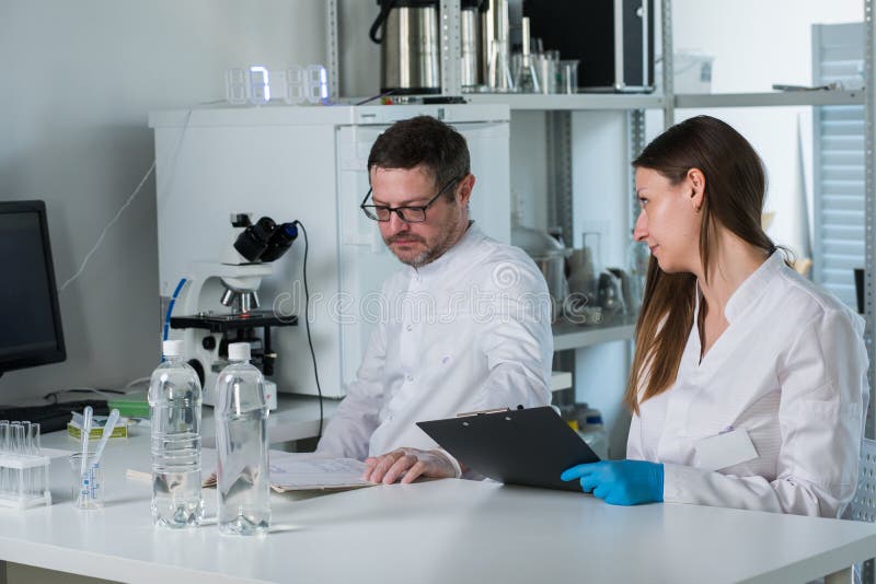 Two Scientists Conducting Research in a Lab Environment Stock Image
