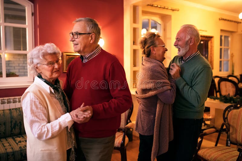 Two senior couple dancing romatic at nursing home