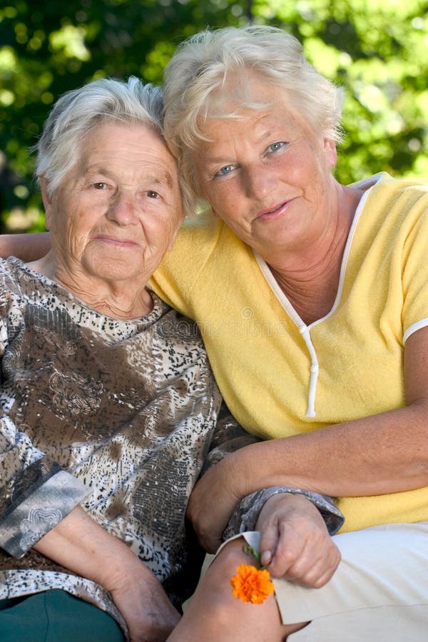 Senior woman with her 60 year old daughter. Old granny stock images, royalty-free photos and pictures
