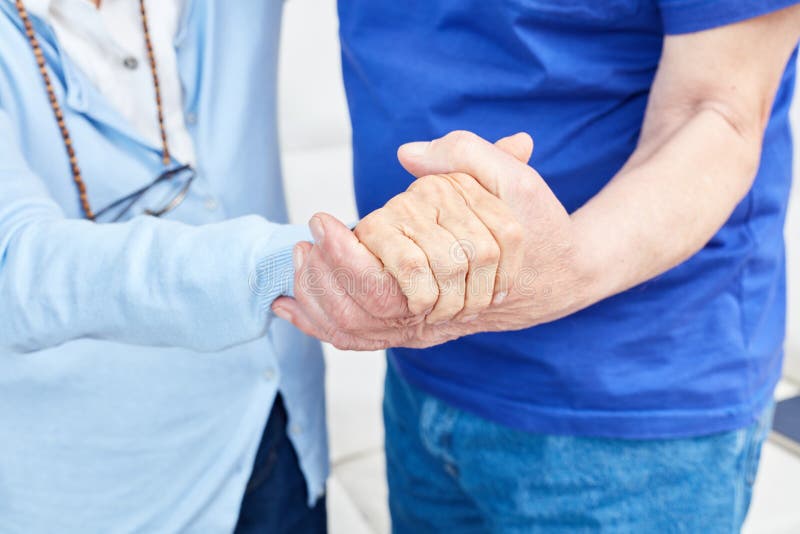 Two seniors hold hands stock images Two seniors hold hands stock images