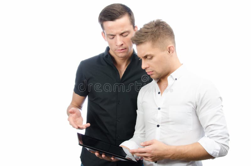 Two Serious Guys are Working on the Project. Tablet and Technology