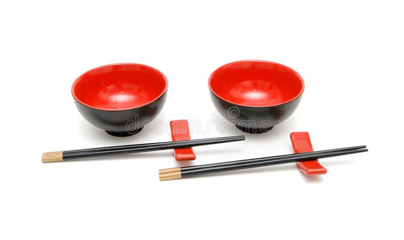 Two sets of chopsticks and bowls isolated