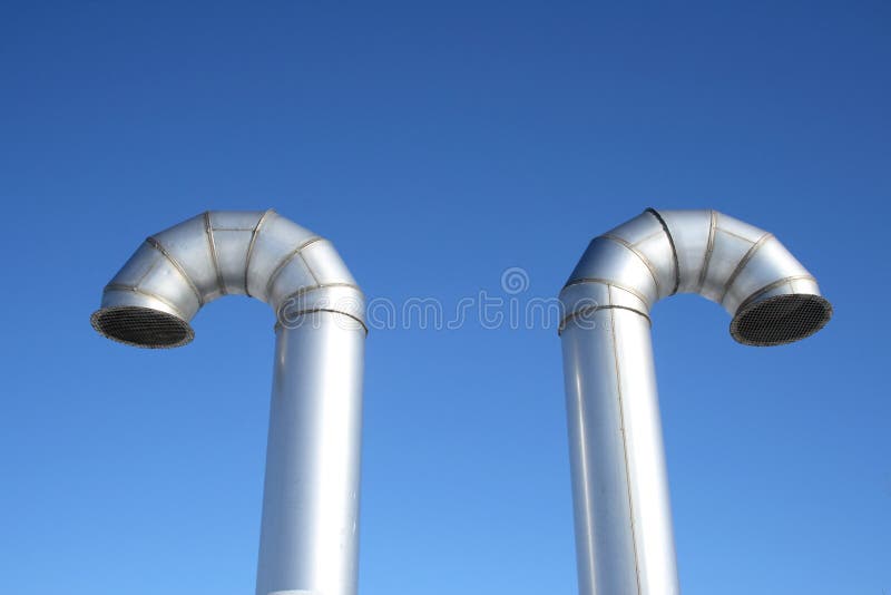 Two shiny metal ventilation pipes