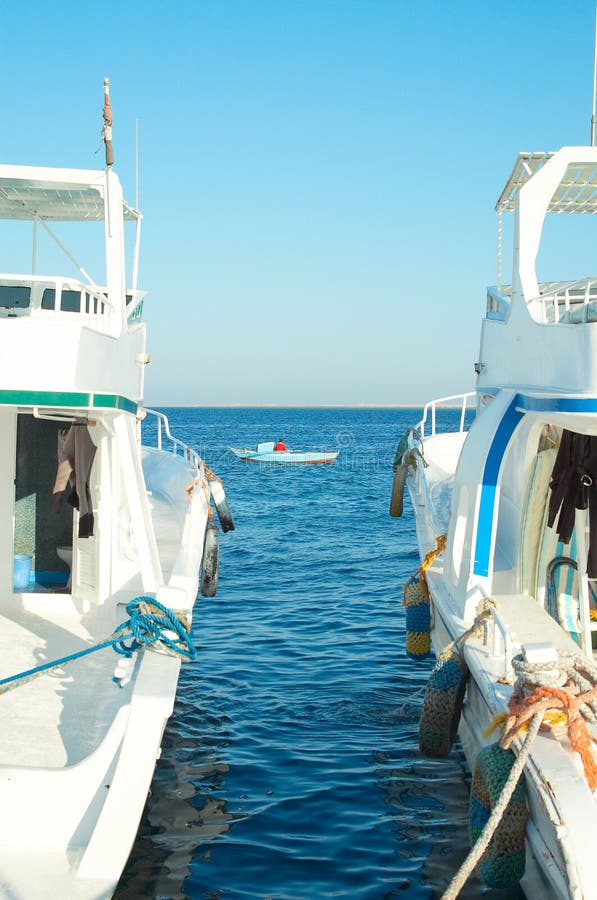 Two ships and little boat