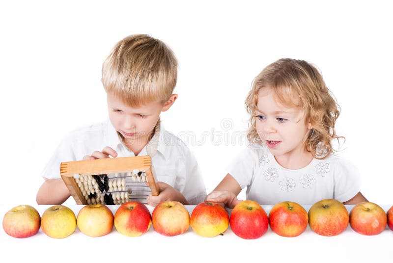 Two siblings counting apples on whit