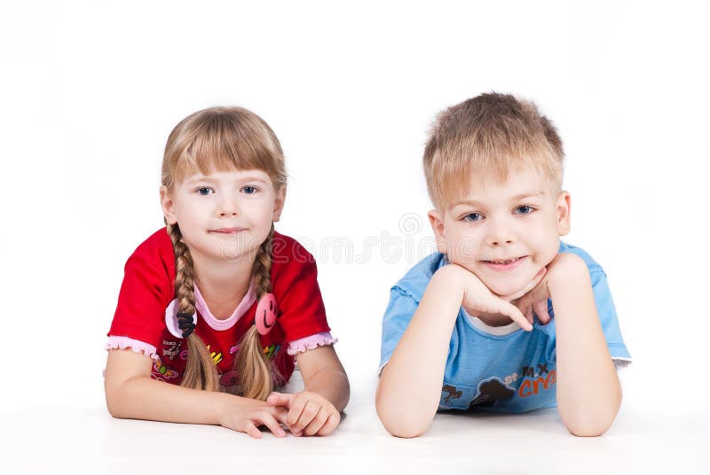 Two siblings lying Isolated on white background