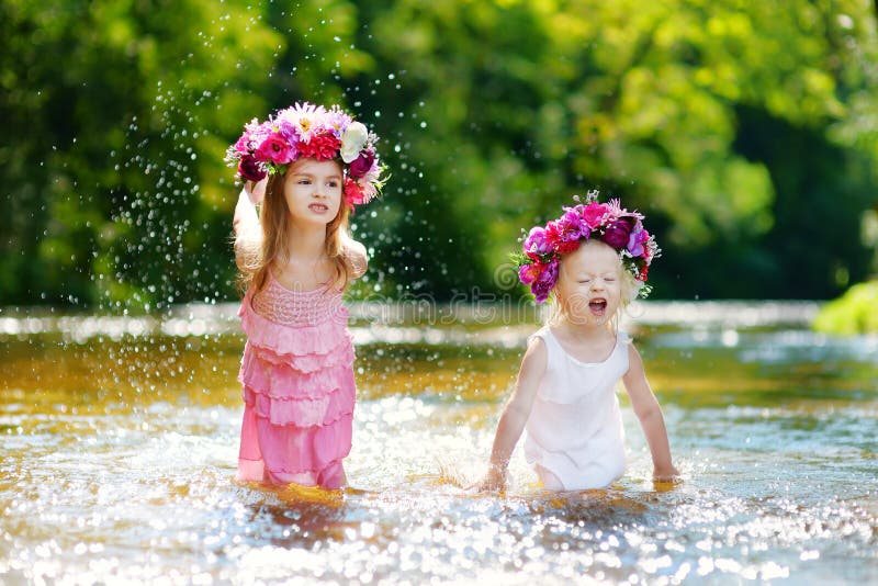 Two Little Sisters Having Fun In A River Stock Image Image Of Summer