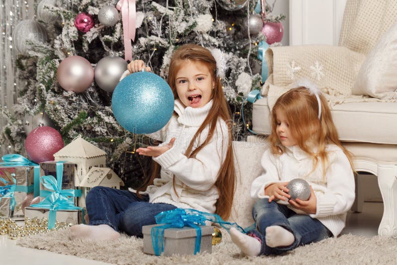 Two Sisters. Merry Christmas. Stock Photo - Image of toddler, surprise ...