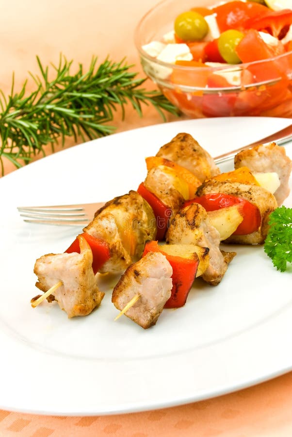 Two skewer with onion and vegetables