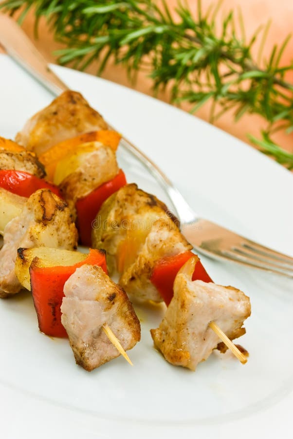 Two skewer with onion and vegetables