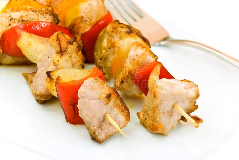 Two skewer with onion and vegetables