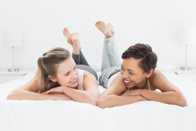 Two Smiling Female Friends Lying In Bed Stock Image Image Of Comfortable Female 37192509